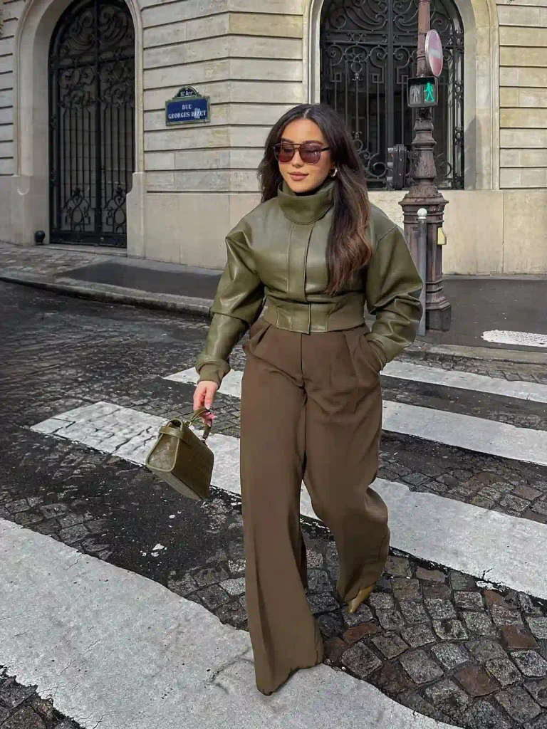 Cropped leather jacket styled with wide pleated trousers