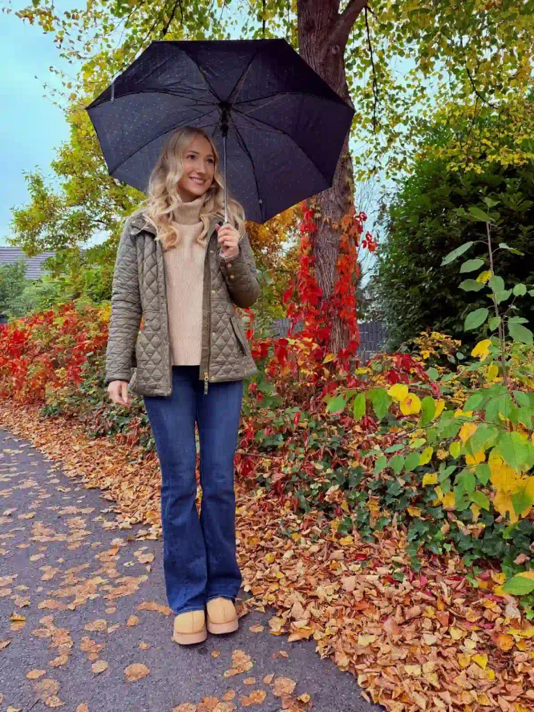 Olive quilted jacket with camel turtleneck and flared jeans