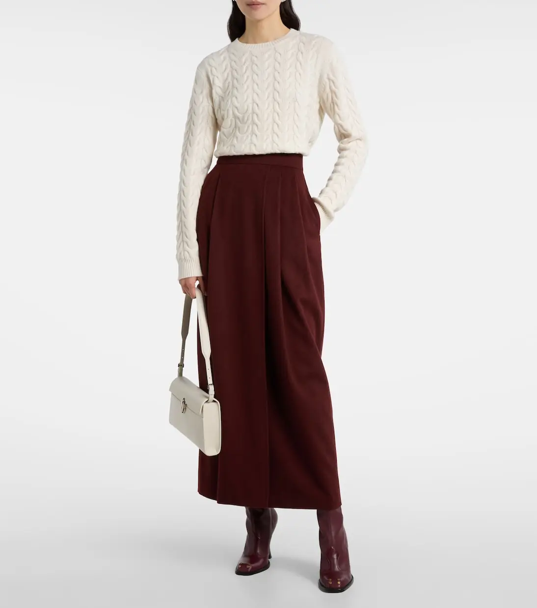 Cream cable knit sweater styled with burgundy wide leg trousers for an elegant winter outfit
